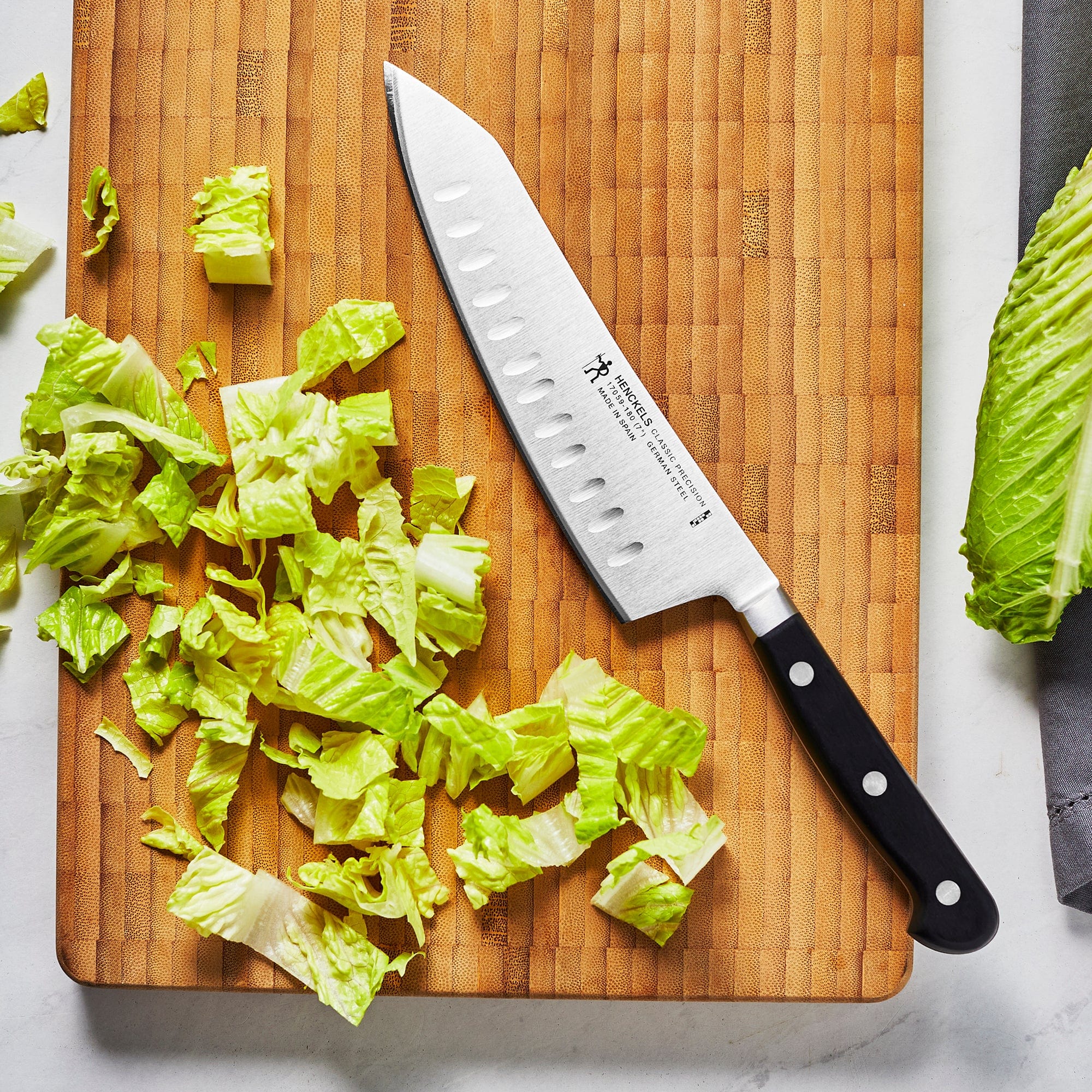 Henckels Classic Precision 7-inch Hollow Edge Rocking Santoku Knife - Image 2